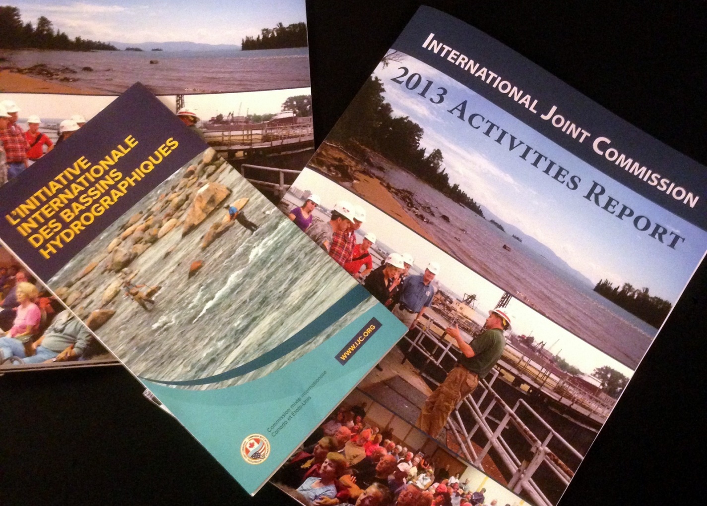 A copy of the 2013 Activities Report, at right, and a brochure from earlier this year on the International Watersheds Initiative.