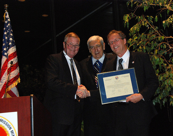 From left to right: Former Commissioner Lyle Knott and Chair Joe Comuzzi pay tribute to retiring IJC engineer Mr. Tom McAuley at the 2012 Fall Semi-Annual Meeting in Ottawa, Ontario. Credit: B. Beckhoff. 