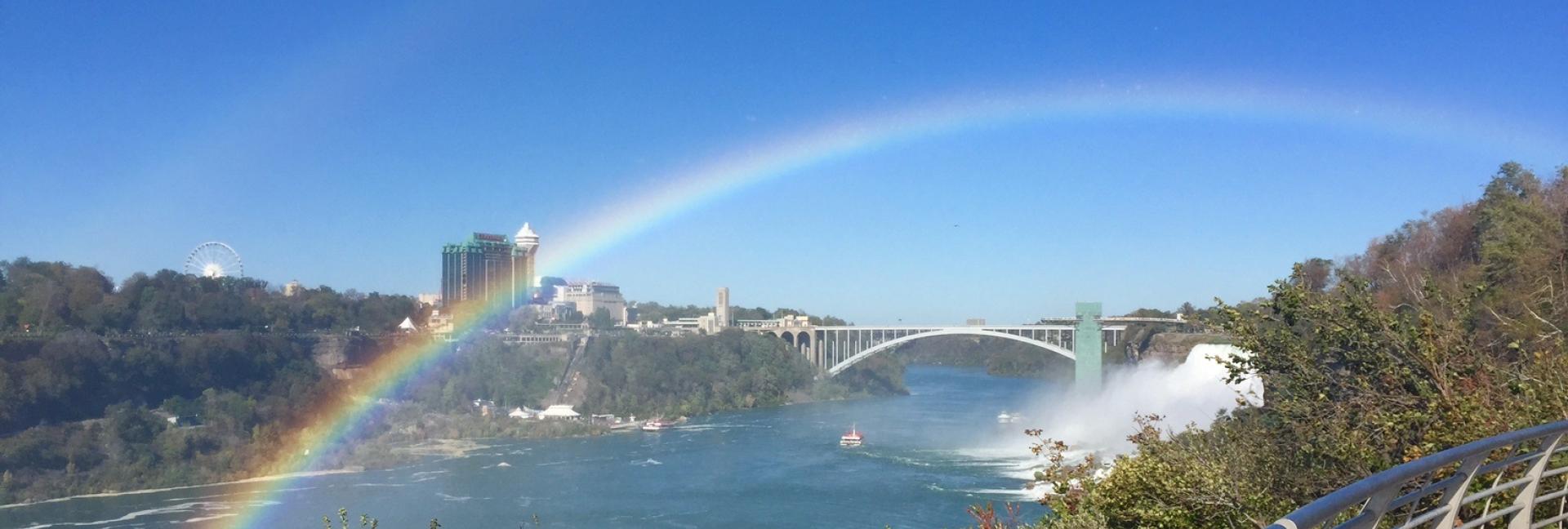 A rainbow shines over the Niagara River.