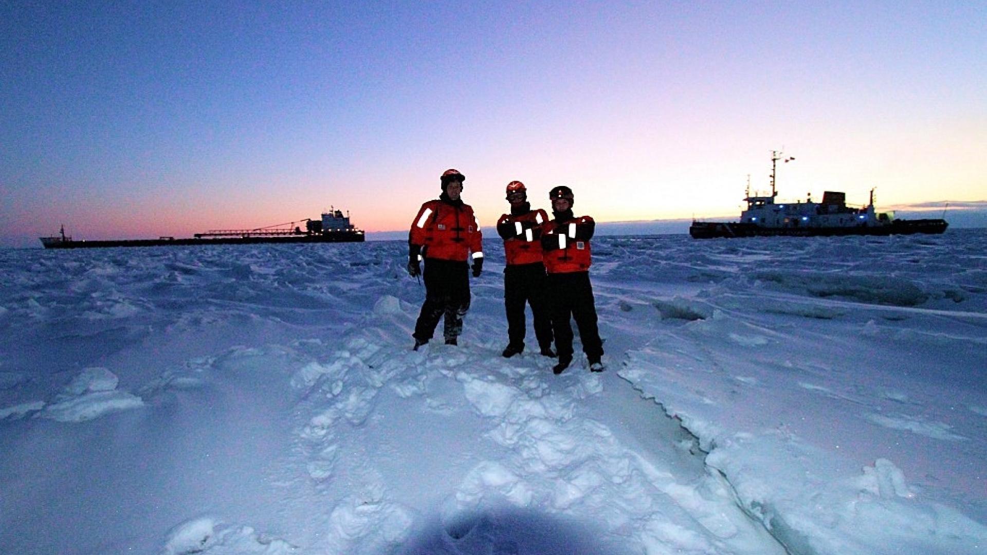 Water Matters - Coast guard officers stand on frozen Lake Huron