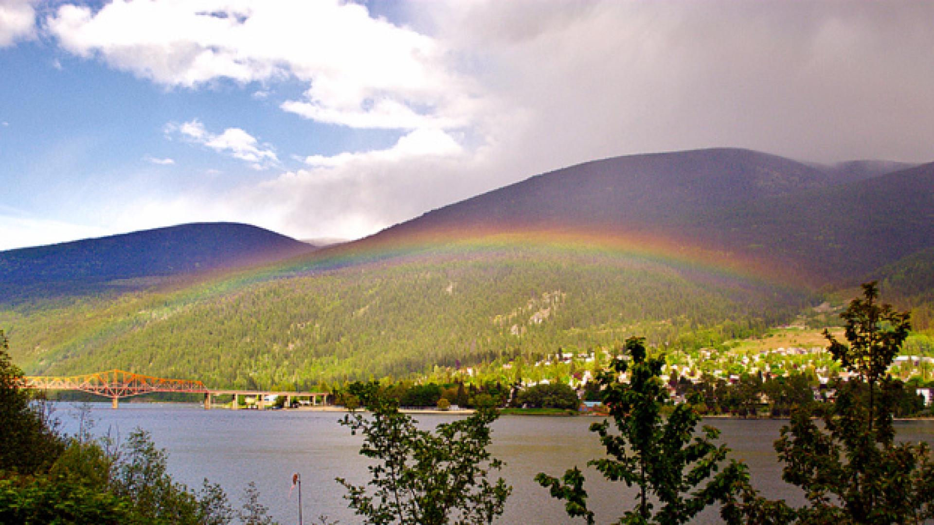 A rainbow over Kootenay Lake and the Nelson Bridge