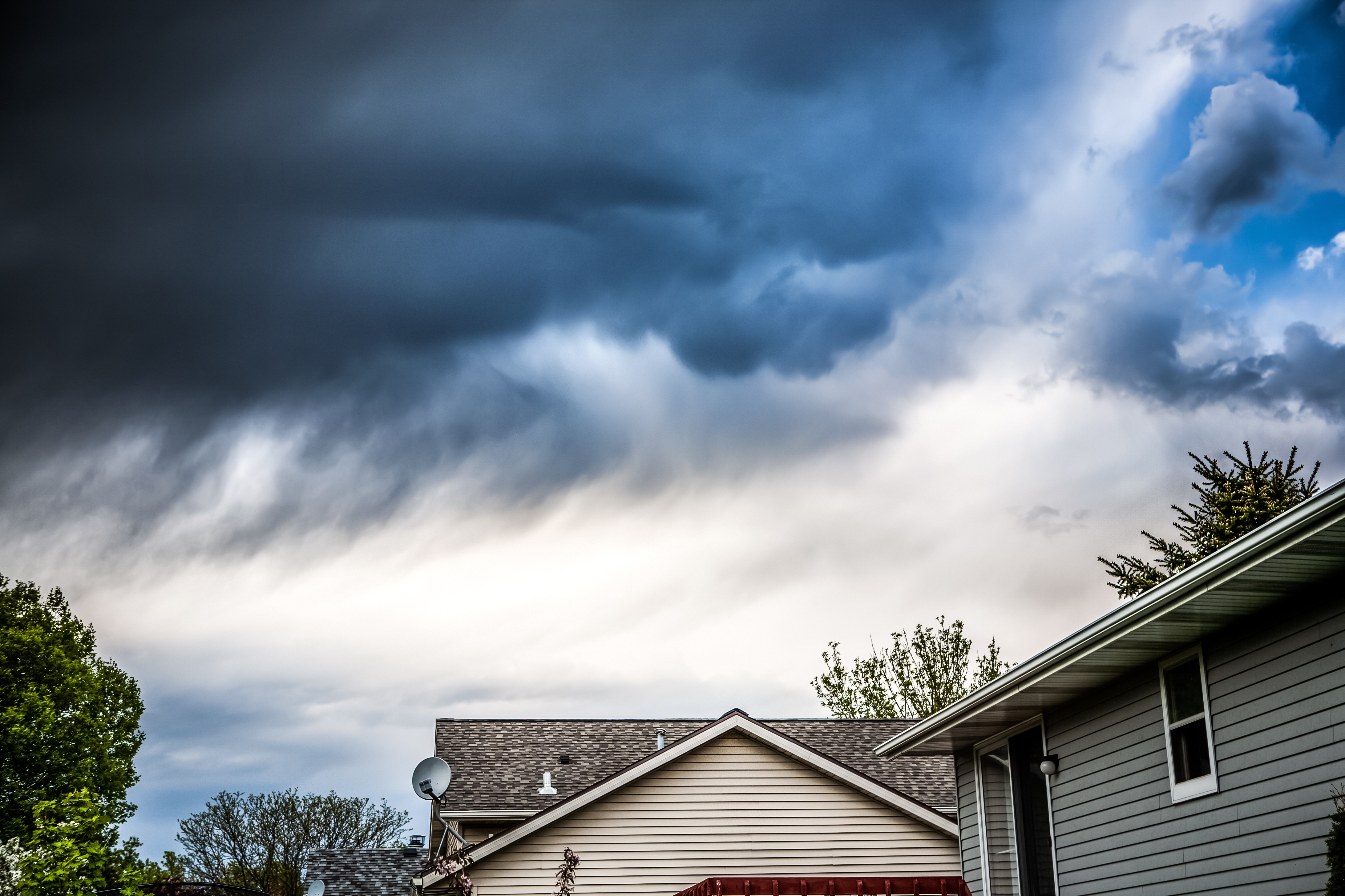 Image of thunderstorm over homes