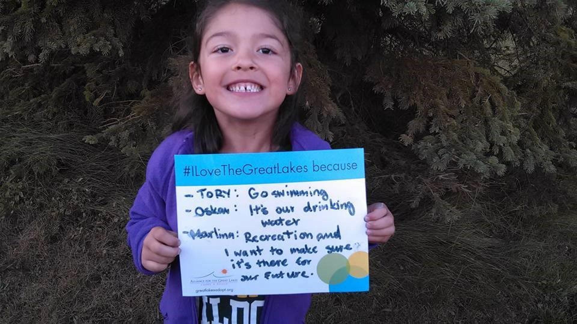 Water Matters - Young girl holding sign "I love the Great Lakes because..."