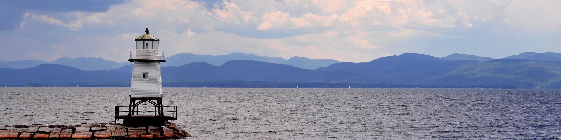 Lighthouse on Lake Champlain with view of mountains